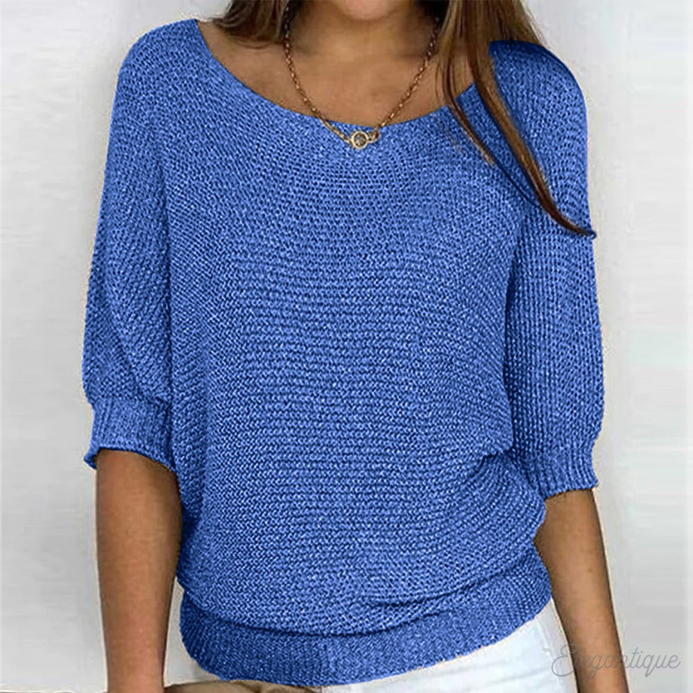 Modieuze dames trui met subtiele open ronde hals, biedt zowel warmte als een elegante uitstraling.