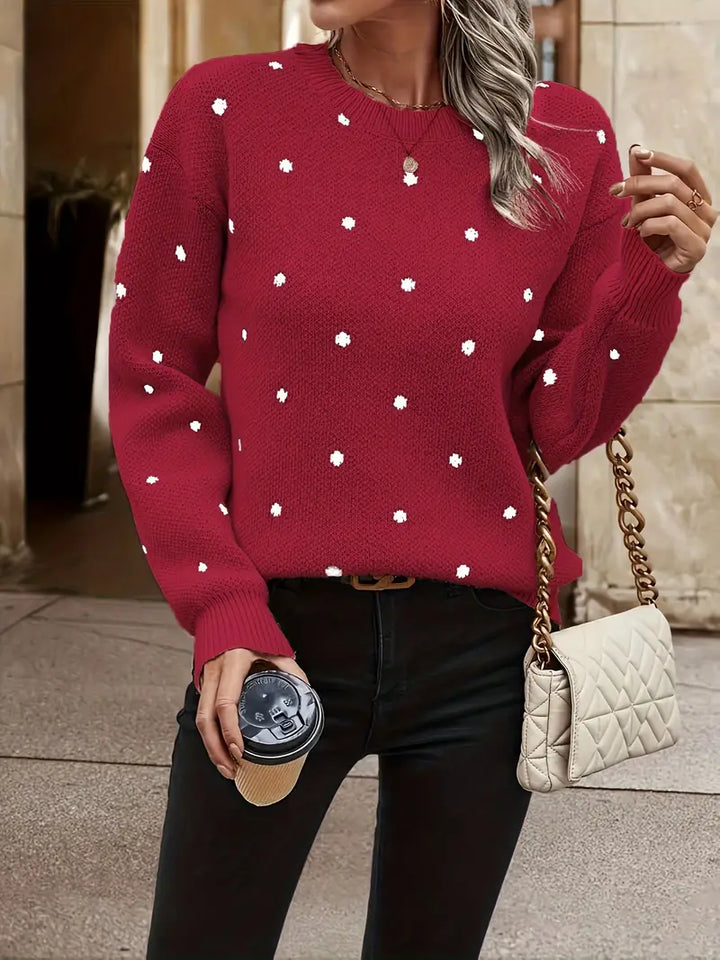 Vrouwelijke polkadot trui met lange mouwen, een veelzijdige toevoeging aan je garderobe.