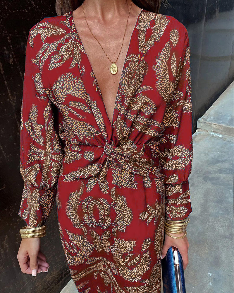 "Elegante dames V-hals midi-jurk met bladerenprint en knoopdetails, lange lantaarnmouwen perfect voor zomerse dagen."