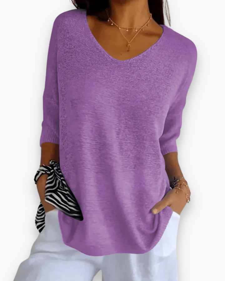 Stijlvolle dames top met V-hals, comfortabele pasvorm en 3/4 mouwen. Veelzijdig en elegant.