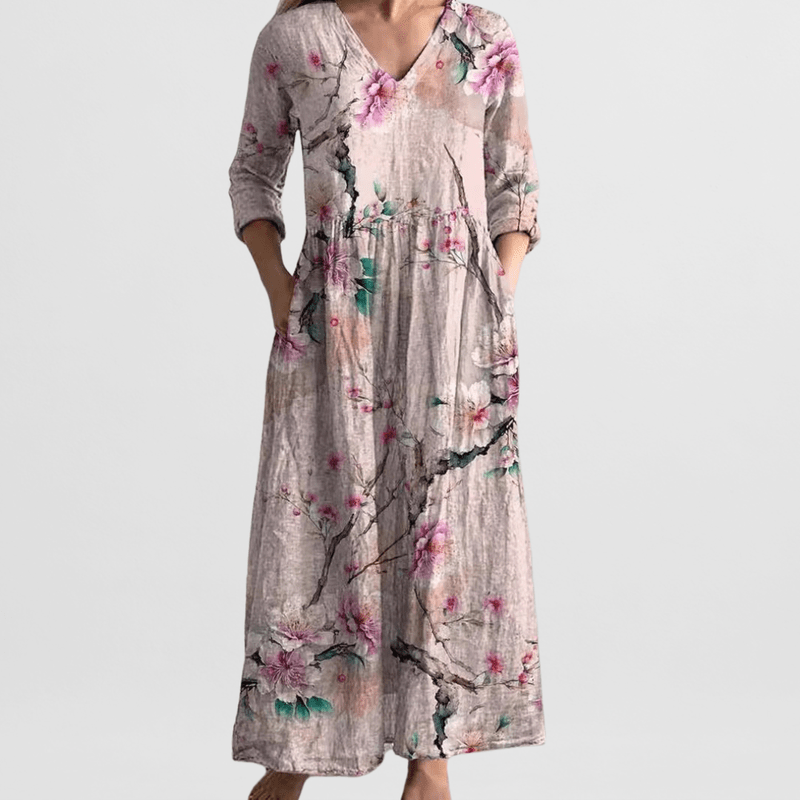 "Elegante dames zomerjurk met bloemenprint, vrouwelijke pasvorm, lichte stof, ideaal voor zonnige dagen en avondjes uit."