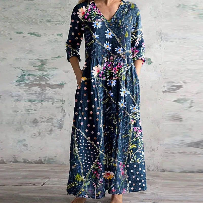"Elegante dames zomerjurk met levendige bloemenprint, luchtige stof, voorzijde weergave, ideaal voor warme dagen."