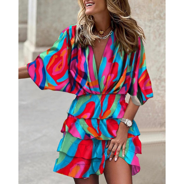 Elegante dames zomerjurk met V-hals en luchtige vleermuismouwen. Comfortabele midi-jurk, perfect voor casual zomerkleding.