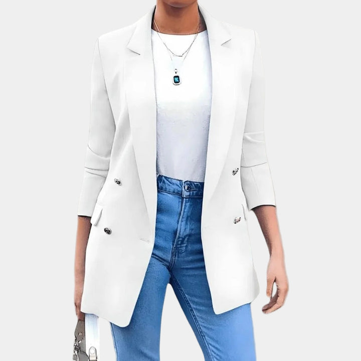 Elegante damesblazer met glanzende gouden knopen en getailleerde pasvorm voor een tijdloos chique look.
