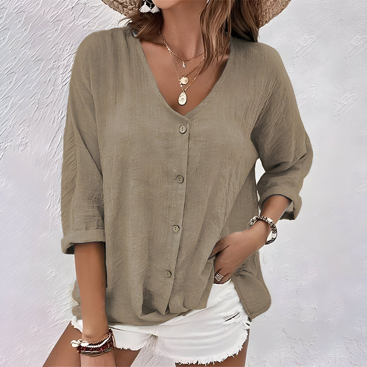 Chique damesblouse met V-hals en 3/4 mouw, ideaal voor een elegante en comfortabele look. Relaxed fit mode.