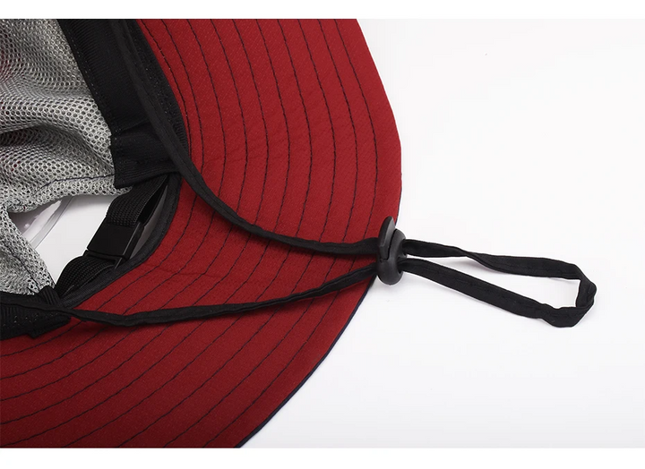 "Elegante dameshoed met brede rand, UV-bescherming in blauwe en roze tinten, ideaal voor zonnige dagen."