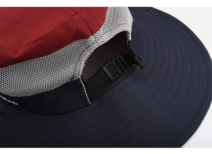 "Elegante dameshoed met brede rand, UV-bescherming in blauwe en roze tinten, ideaal voor zonnige dagen."