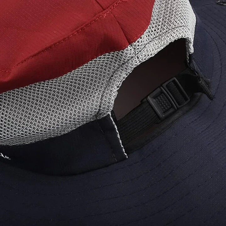 "Elegante dameshoed met brede rand, UV-bescherming in blauwe en roze tinten, ideaal voor zonnige dagen."