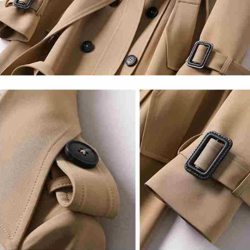 Vrouwelijke lange trenchcoat met dubbele rij knopen, gedragen door model; essentiële dameskleding.