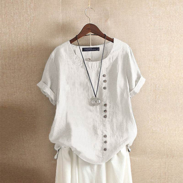 Blouse dames wit, korte mouw, knoopsluiting, elegante uitstraling.
