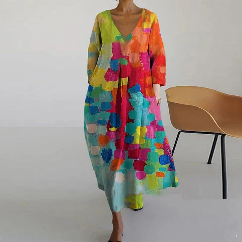 "Elegante maxi jurk met abstracte bloemenprint, bohemian stijl, lange mouwen, zakken, V-hals, perfect voor zomerdagen."