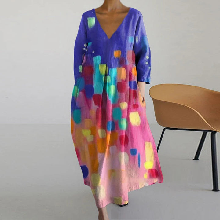 "Elegante maxi jurk met abstracte bloemenprint, bohemian stijl, lange mouwen, zakken, V-hals, perfect voor zomerdagen."