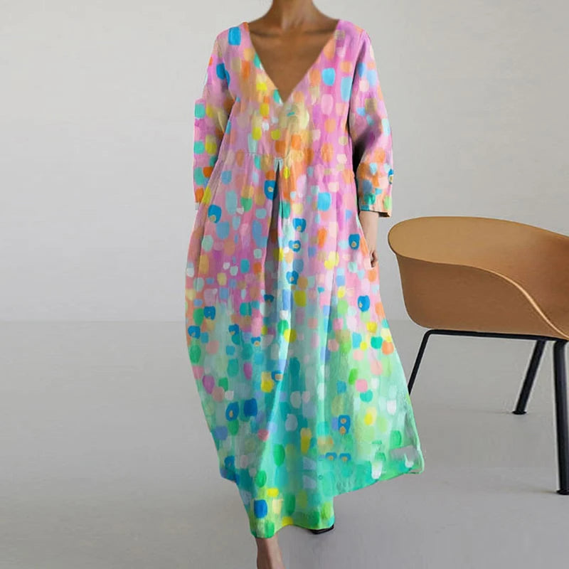 "Elegante maxi jurk met abstracte bloemenprint, bohemian stijl, lange mouwen, zakken, V-hals, perfect voor zomerdagen."