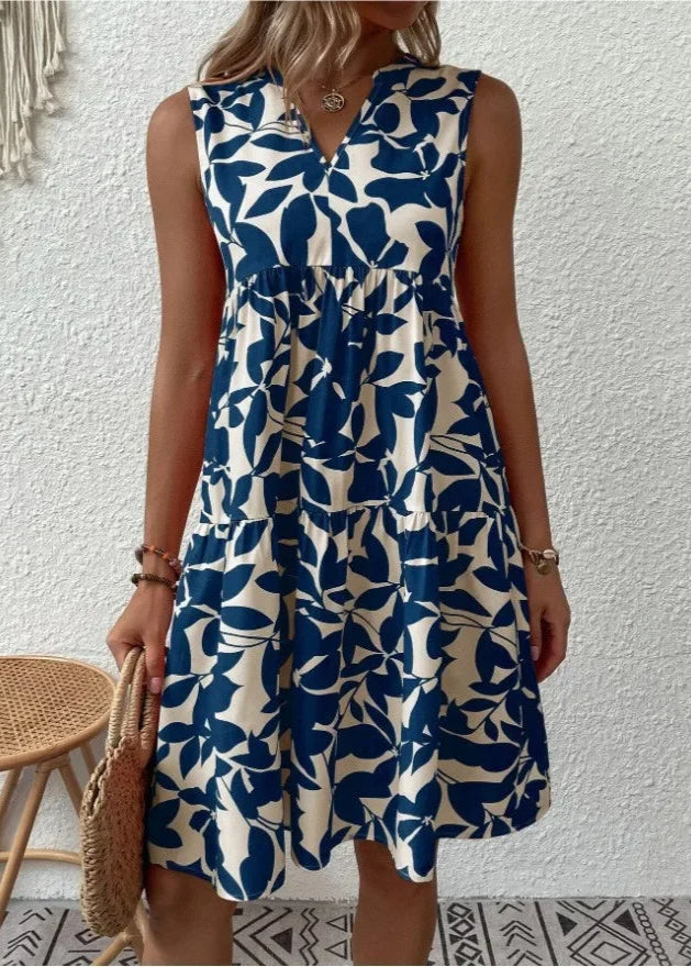 Elegante midi-jurk met V-hals, zomerse bloemenprint, luchtige stof, mouwloos, ideaal voor warme dagen en stijlvolle uitstrali
