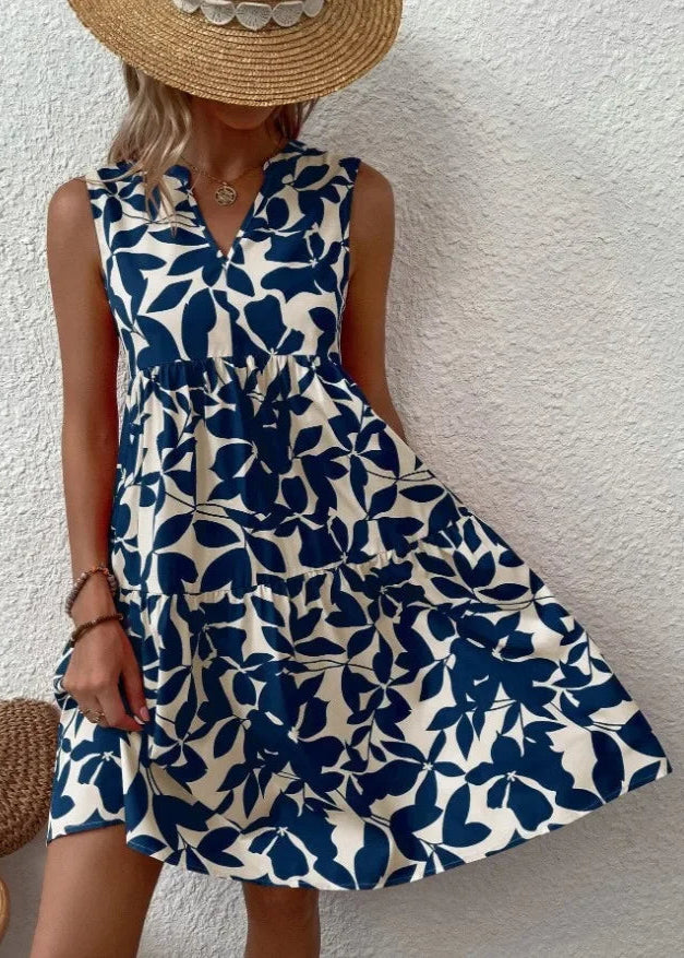 Elegante midi-jurk met V-hals, zomerse bloemenprint, luchtige stof, mouwloos, ideaal voor warme dagen en stijlvolle uitstrali