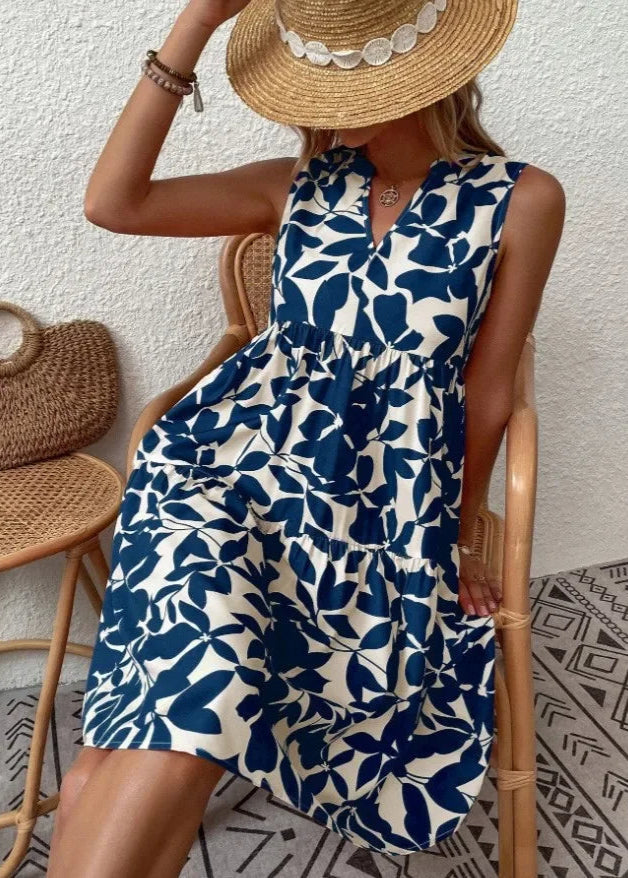 Elegante midi-jurk met V-hals, zomerse bloemenprint, luchtige stof, mouwloos, ideaal voor warme dagen en stijlvolle uitstrali