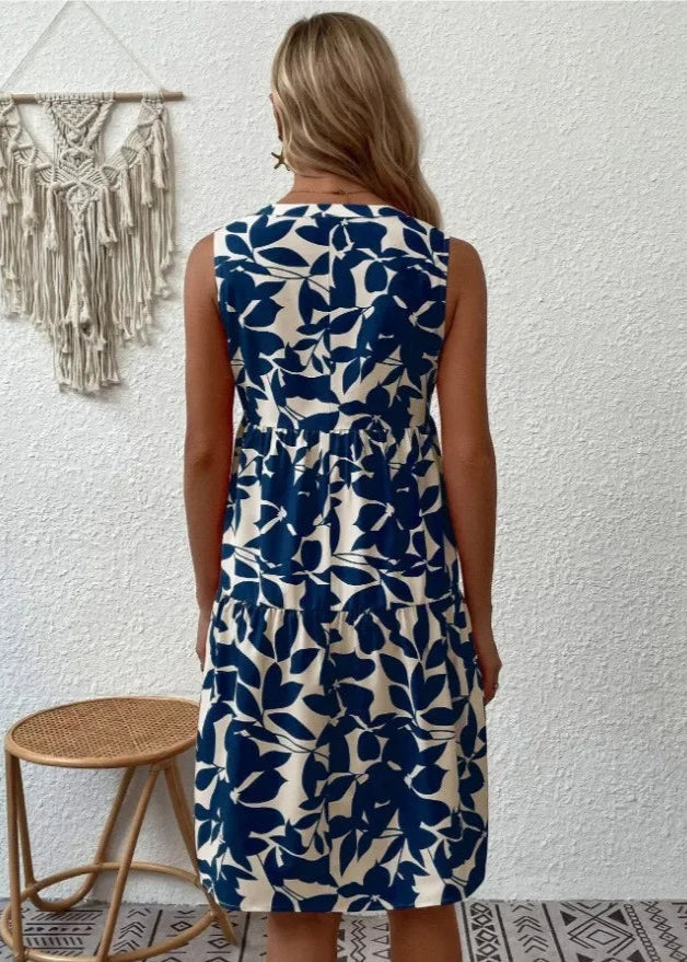 Elegante midi-jurk met V-hals, zomerse bloemenprint, luchtige stof, mouwloos, ideaal voor warme dagen en stijlvolle uitstrali