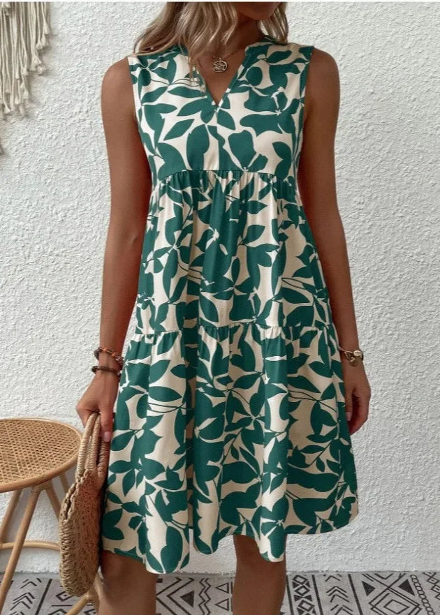 Elegante midi-jurk met V-hals, zomerse bloemenprint, luchtige stof, mouwloos, ideaal voor warme dagen en stijlvolle uitstrali