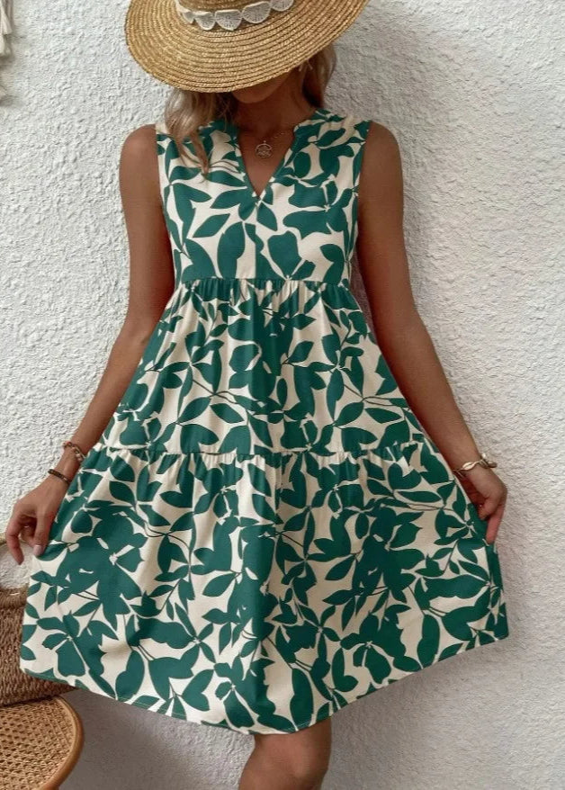 Elegante midi-jurk met V-hals, zomerse bloemenprint, luchtige stof, mouwloos, ideaal voor warme dagen en stijlvolle uitstrali