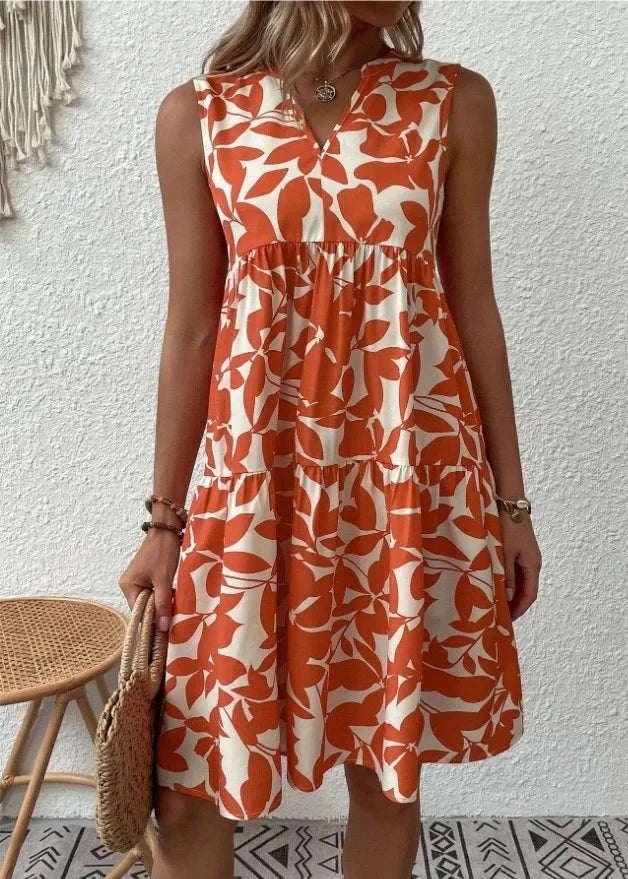 Elegante midi-jurk met V-hals, zomerse bloemenprint, luchtige stof, mouwloos, ideaal voor warme dagen en stijlvolle uitstrali