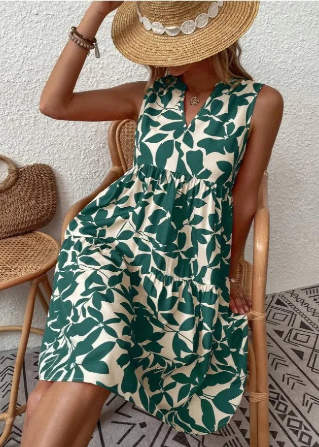 Elegante midi-jurk met V-hals, zomerse bloemenprint, luchtige stof, mouwloos, ideaal voor warme dagen en stijlvolle uitstrali