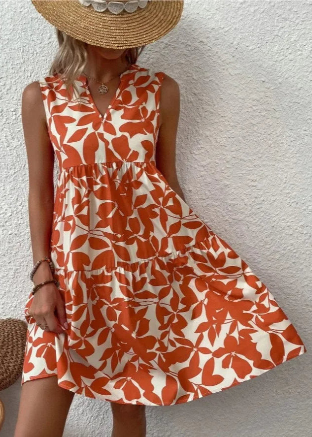 Elegante midi-jurk met V-hals, zomerse bloemenprint, luchtige stof, mouwloos, ideaal voor warme dagen en stijlvolle uitstrali