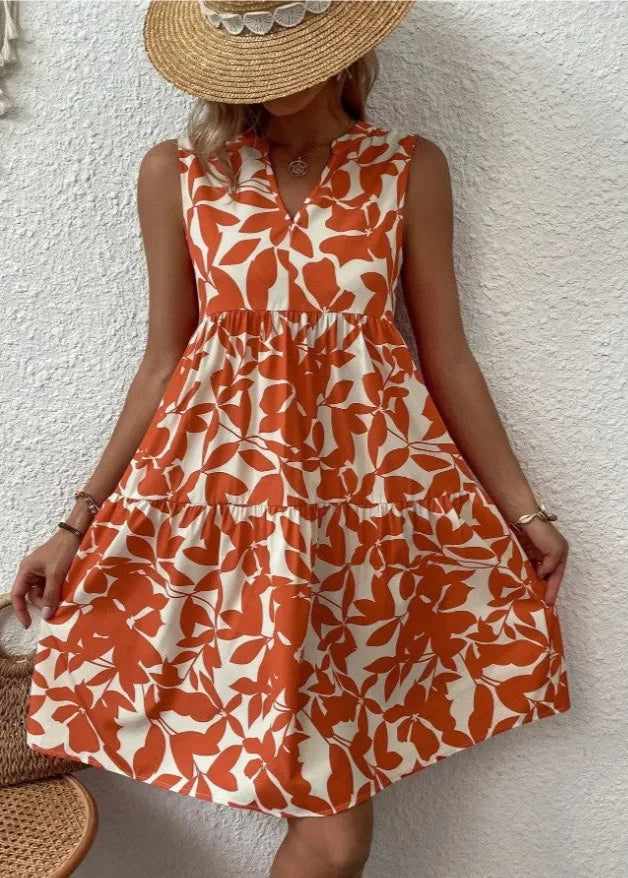 Elegante midi-jurk met V-hals, zomerse bloemenprint, luchtige stof, mouwloos, ideaal voor warme dagen en stijlvolle uitstrali