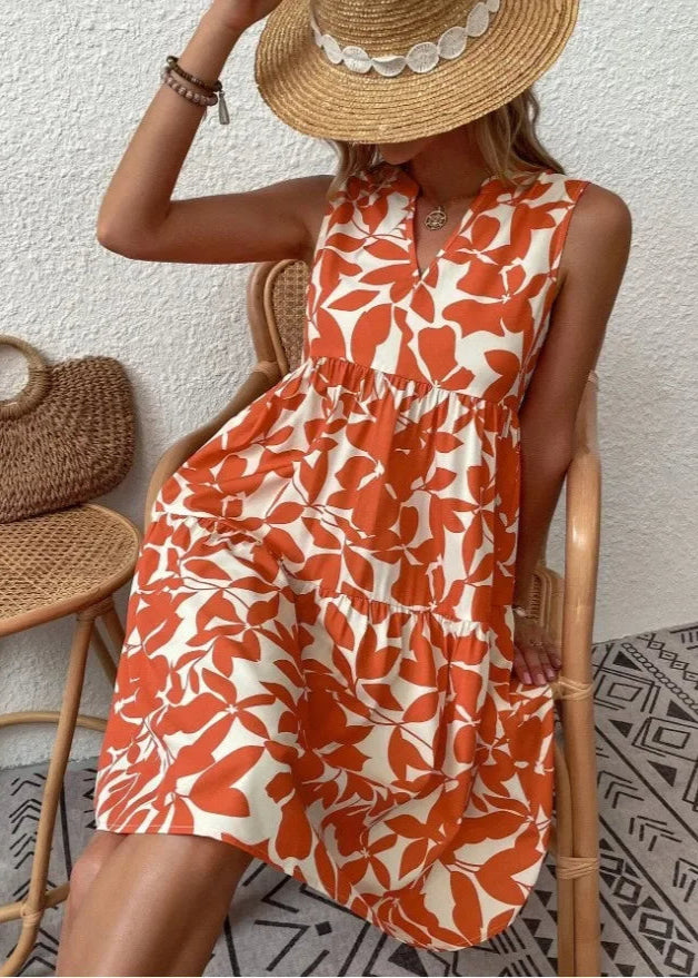 Elegante midi-jurk met V-hals, zomerse bloemenprint, luchtige stof, mouwloos, ideaal voor warme dagen en stijlvolle uitstrali