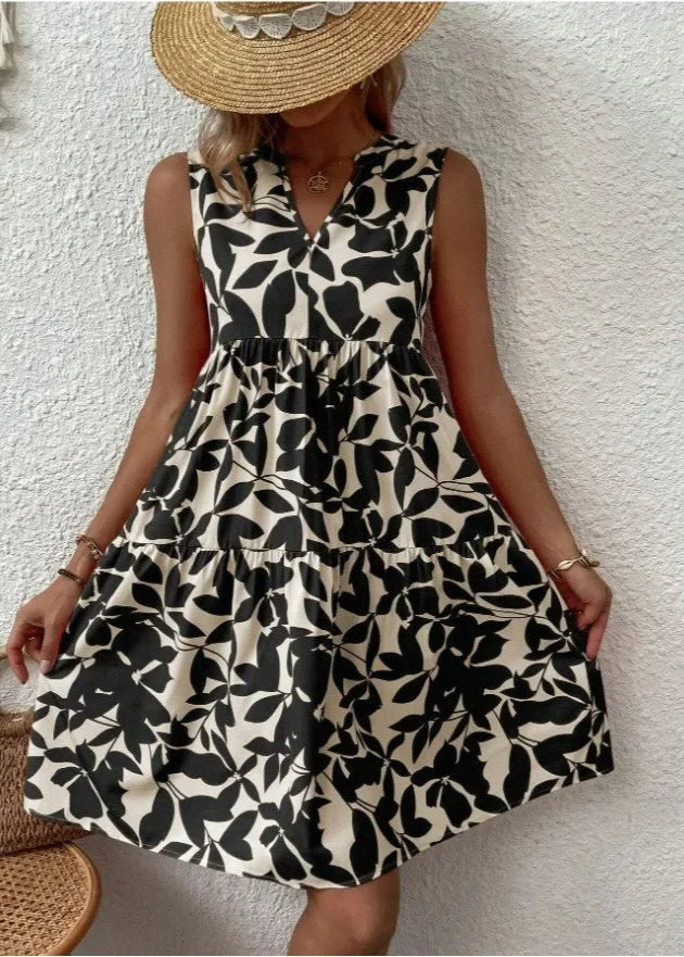 Elegante midi-jurk met V-hals, zomerse bloemenprint, luchtige stof, mouwloos, ideaal voor warme dagen en stijlvolle uitstrali