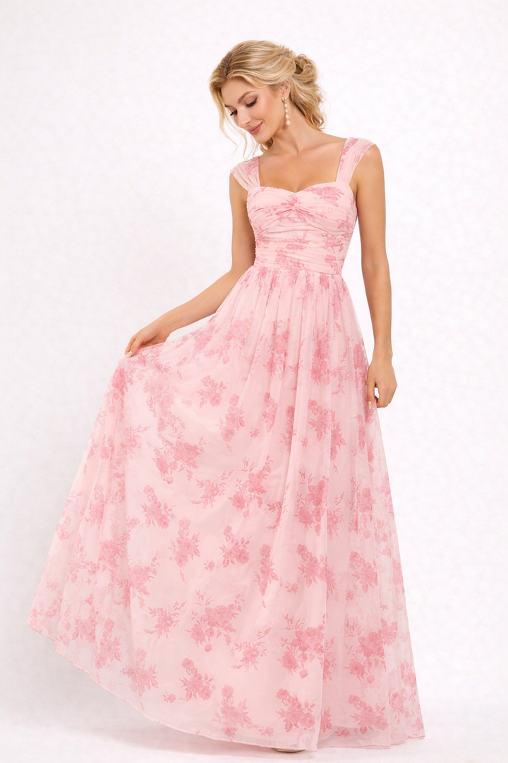Elegante roze dames maxijurk met verfijnde bloemenprint, perfect voor een feest of formele gelegenheid.