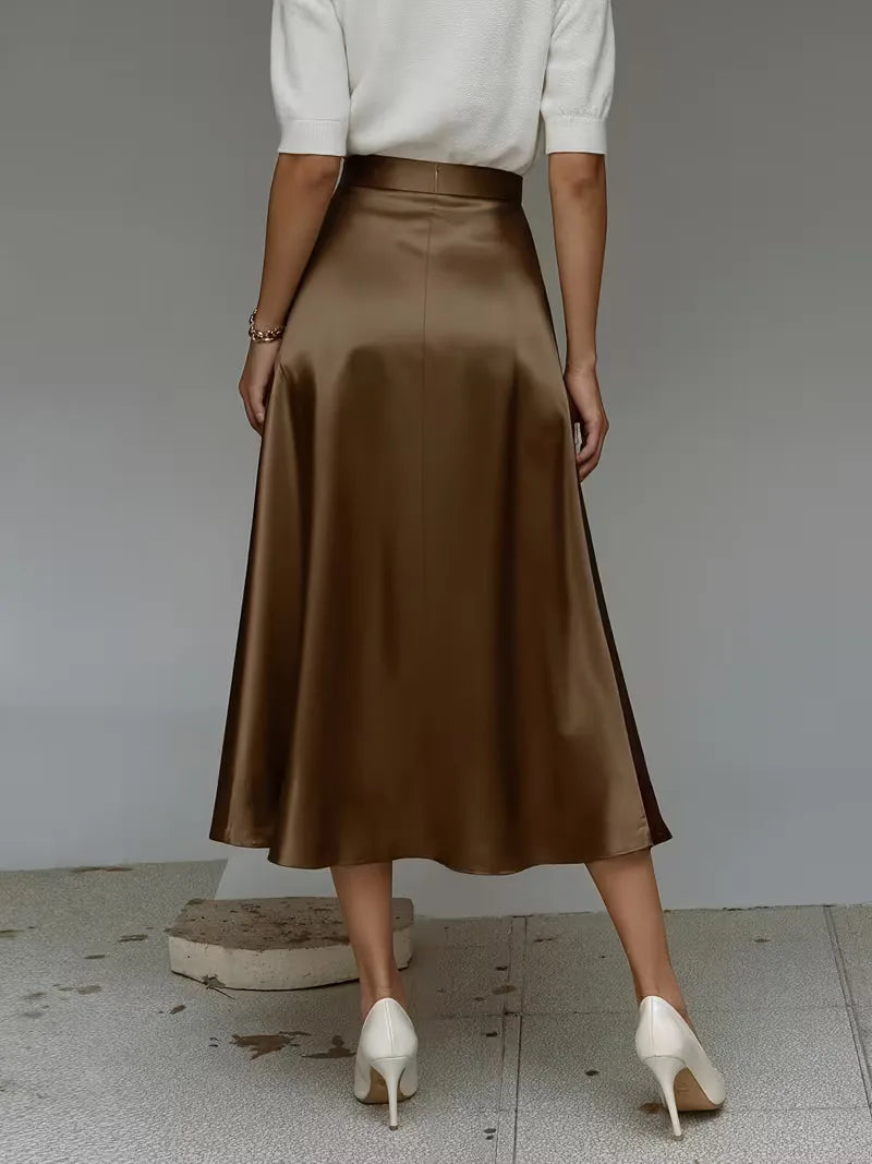 Chique hoogtaille satijnen midirok in turquoise. Perfect voor de zomerrok collectie van elke dame.