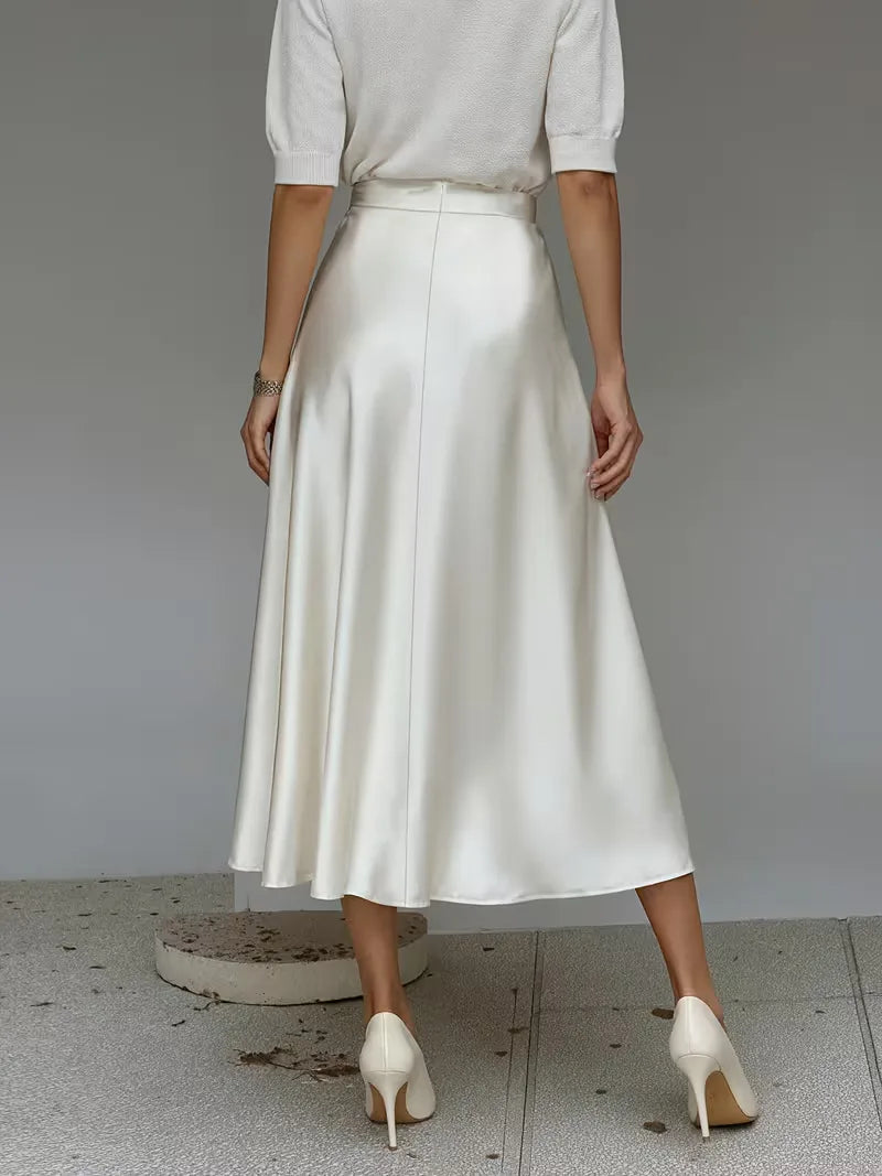 Casual chique satijnen damesrok in koraal, hoge taille. Perfecte midi rok voor zomerse dagen.