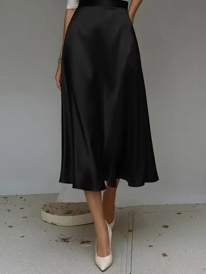 Elegante satijnen midirok in chocoladebruin, hoge taille. Stijlvol voor smart casual damesoutfits.