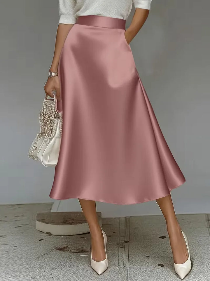 Veelzijdige damesrok van satijn in mintgroen, hoge taille. Ideale midi rok voor frisse lentestijlen.
