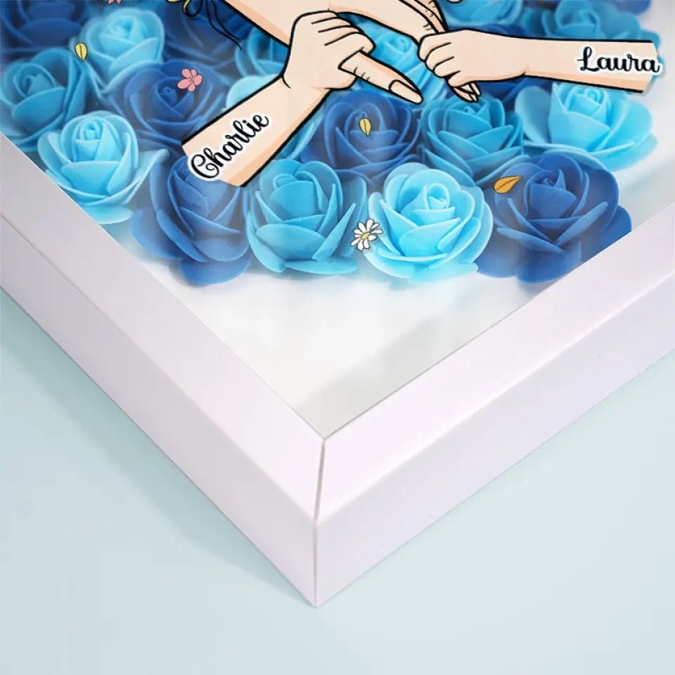 Warm verlicht bloemenlijstje, gepersonaliseerd met namen en lieve woorden, perfect voor Moederdag.