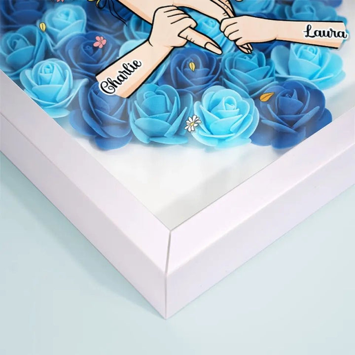 Warm verlicht bloemenlijstje, gepersonaliseerd met namen en lieve woorden, perfect voor Moederdag.