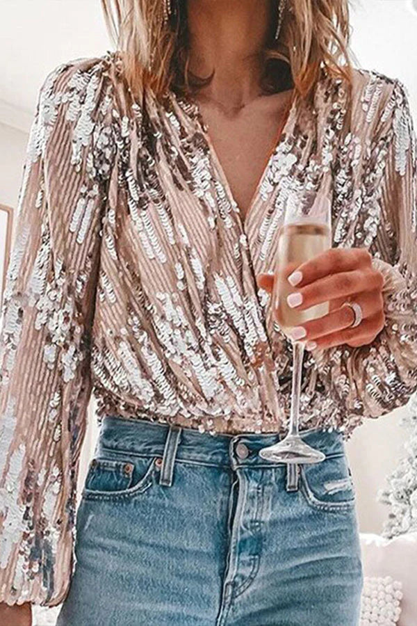 "Glamour blouse met glinsterende pailletten, V-hals en ballonmouwen, perfect voor feestelijke avonden en speciale gelegenhede