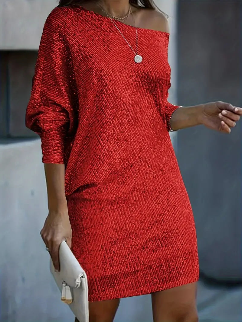Vrouwenmode feestjurk met glanzende pailletten en chic contrast. Perfecte lentejurk voor een stijlvolle avond.