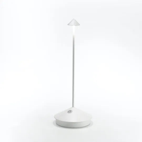Overzicht van de Glowy draadloze lamp met alle accessoires, oplaadkabel inbegrepen.