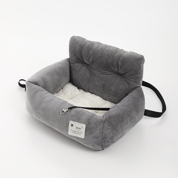 "Grijze honden autostoel, veilig en comfortabel. Zachte bekleding, waterafstotend, eenvoudig te installeren. Ideaal voor auto
