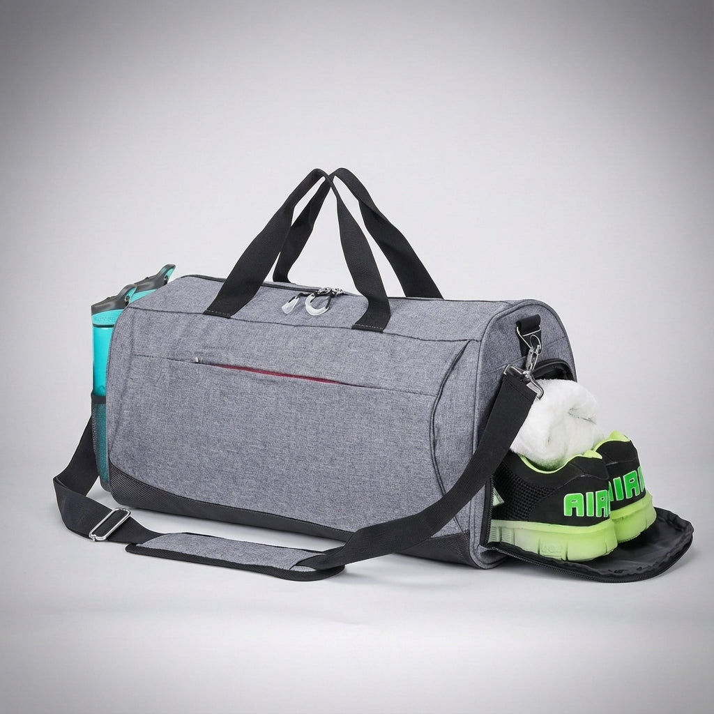Veelzijdige grijze 30 liter TravelDry duffeltas, waterdicht en compact, met handig vak voor schoenen of natte kleding.