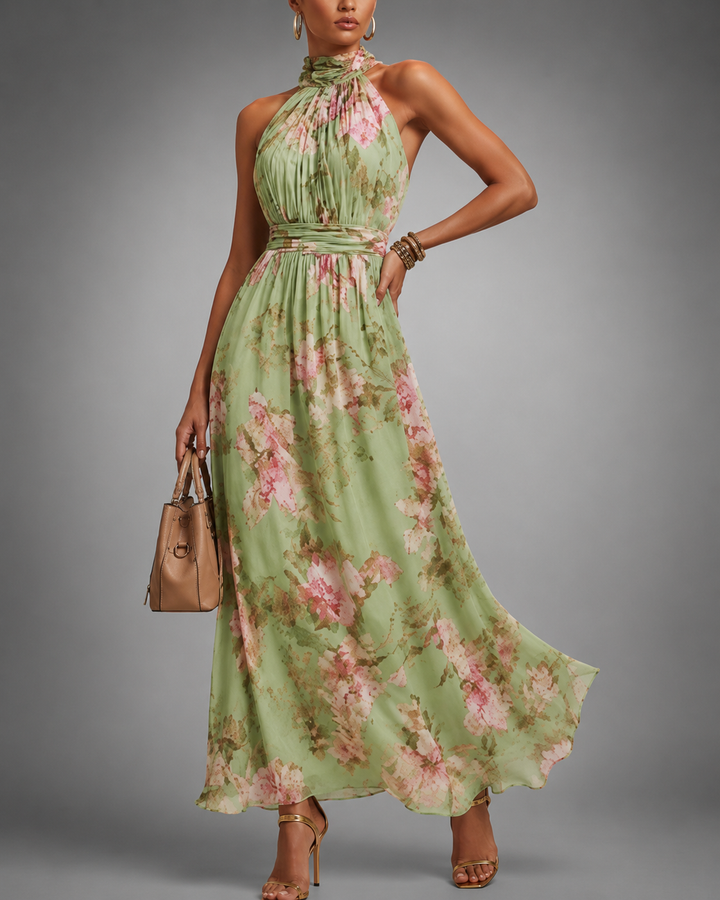 Elegante dames maxi jurk met levendige bloemenprint en verfijnde halternek, een prachtige mouwloze A-lijn jurk voor de zomer.