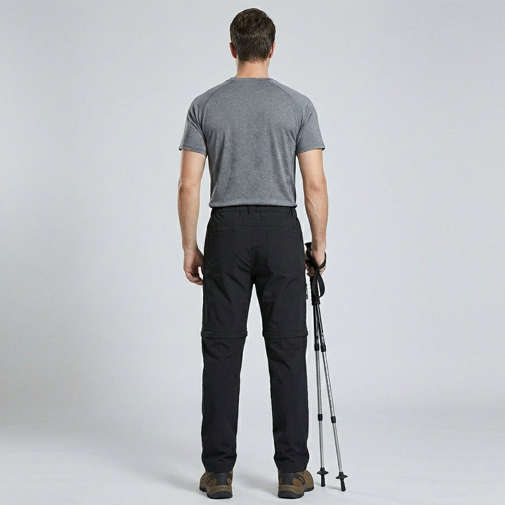 Zwarte heren trekkingbroek met afritsbare pijpen, perfect voor wandelen in elk seizoen.