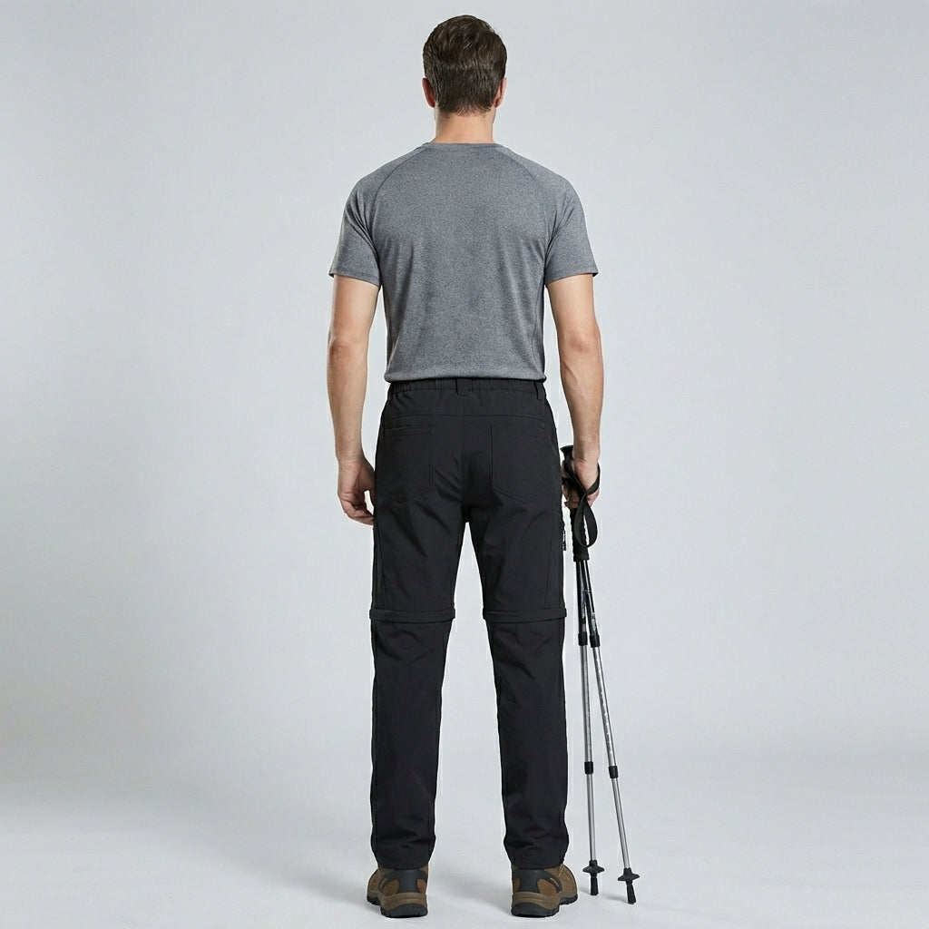 Zwarte heren trekkingbroek met afritsbare pijpen, perfect voor wandelen in elk seizoen.