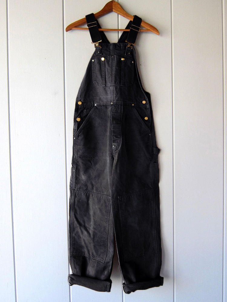 Comfortabele heren werkoutfit: duurzame canvas overall met veel bewegingsvrijheid.