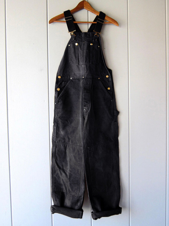 Comfortabele heren werkoutfit: duurzame canvas overall met veel bewegingsvrijheid.