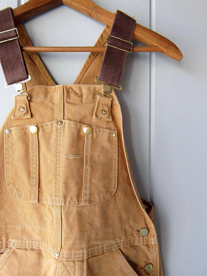 Utility heren overall van canvas met handige zakken voor gereedschap en benodigdheden.
