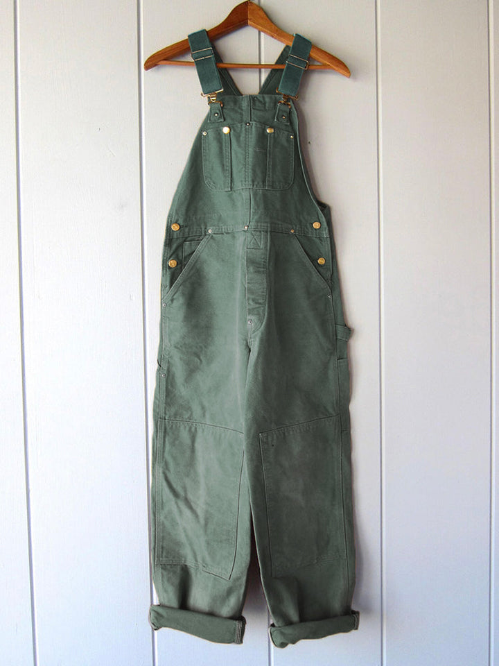 Ademende canvas heren dungarees, slijtvast en functioneel, ideaal voor diverse werkzaamheden.