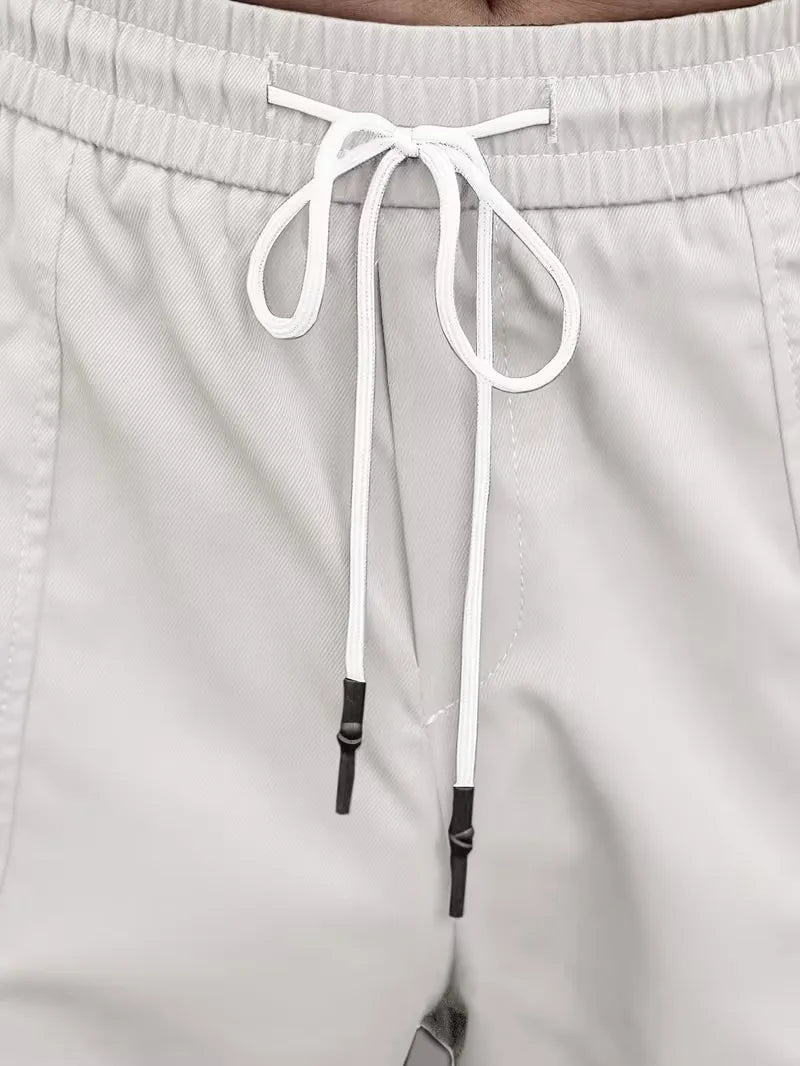 Trendy heren cargobroek, elastische taille, rechte pijp, comfortabel, streetwear ready voor herfst.