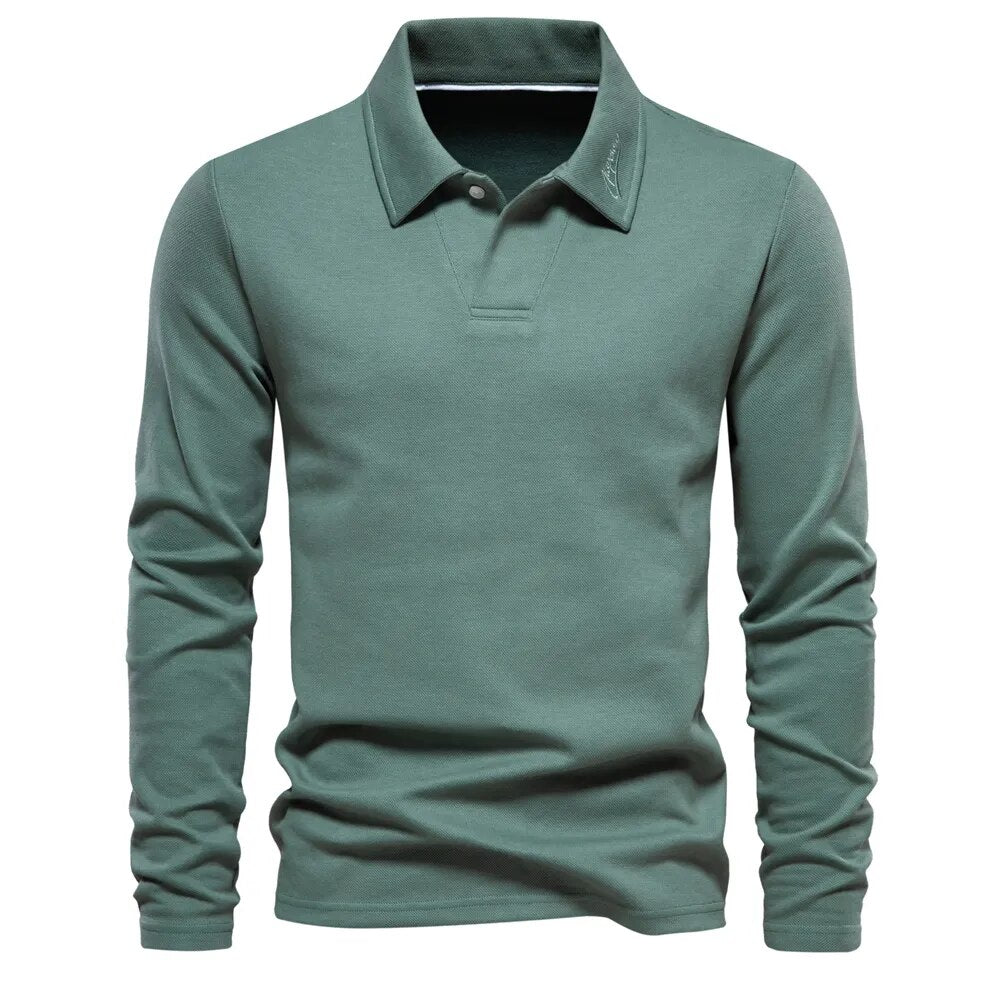 Grijs heren poloshirt met lange mouwen, een veelzijdige en comfortabele toevoeging aan herenmode.